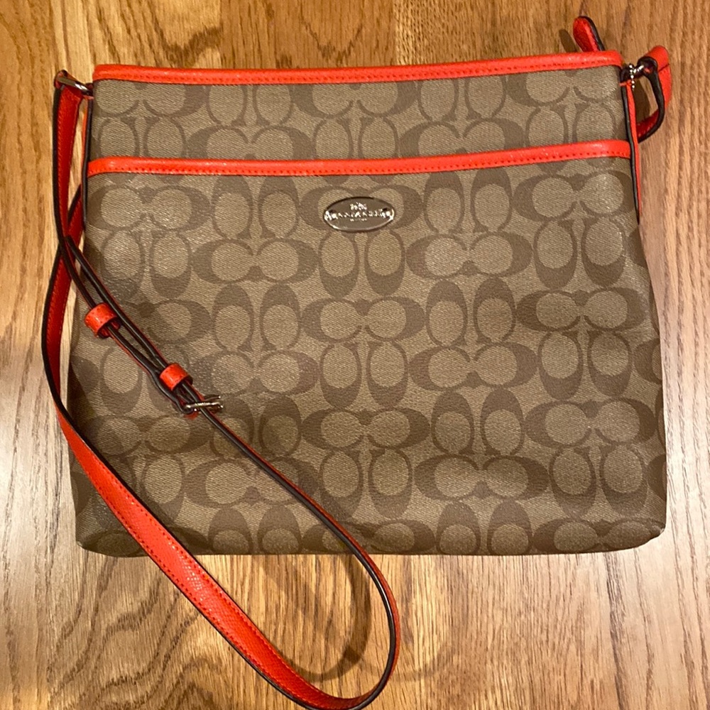 Coach brown logo crossbody with orange trim and strap